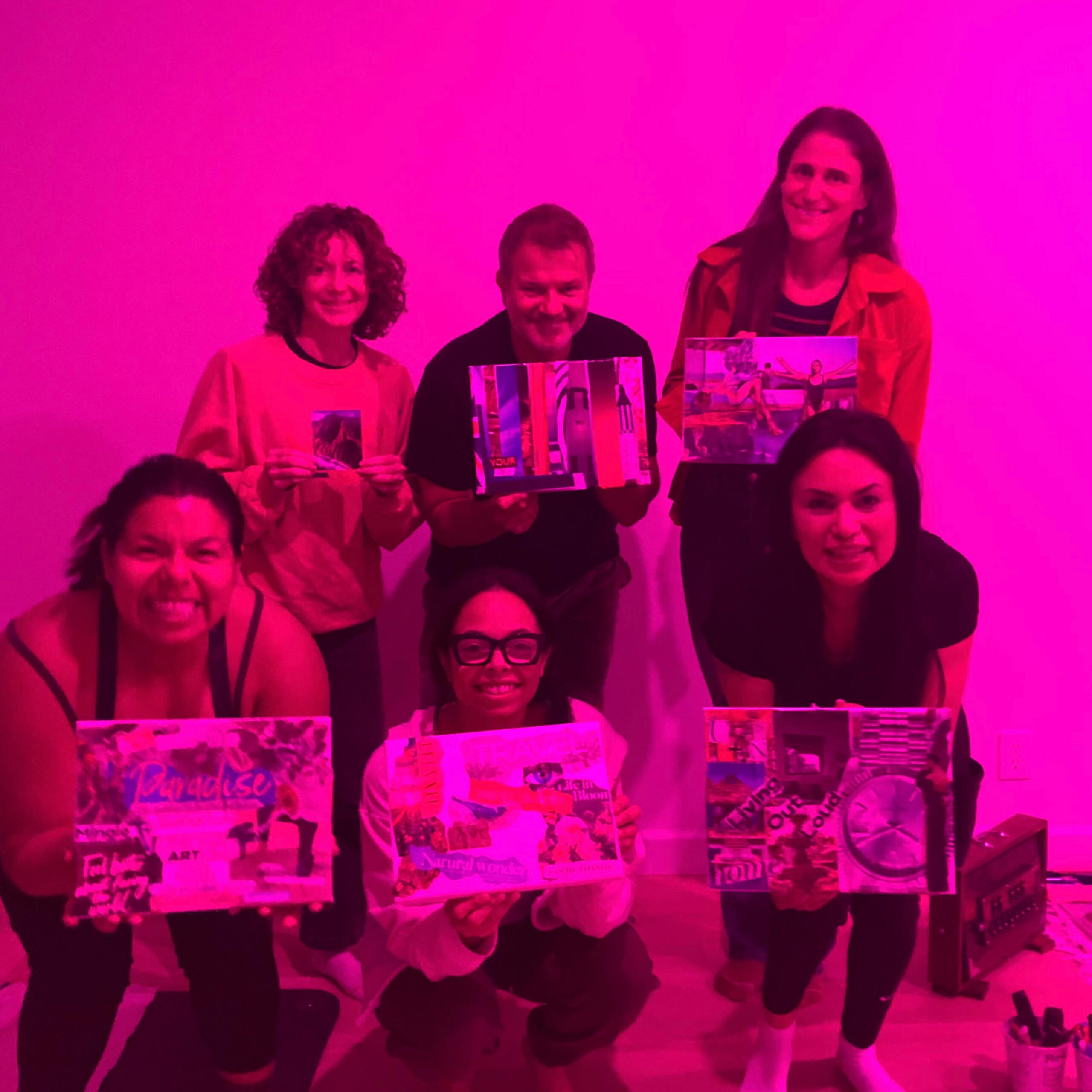 participants in the Harmony & Vision sound bath with art event proudly display their collage art